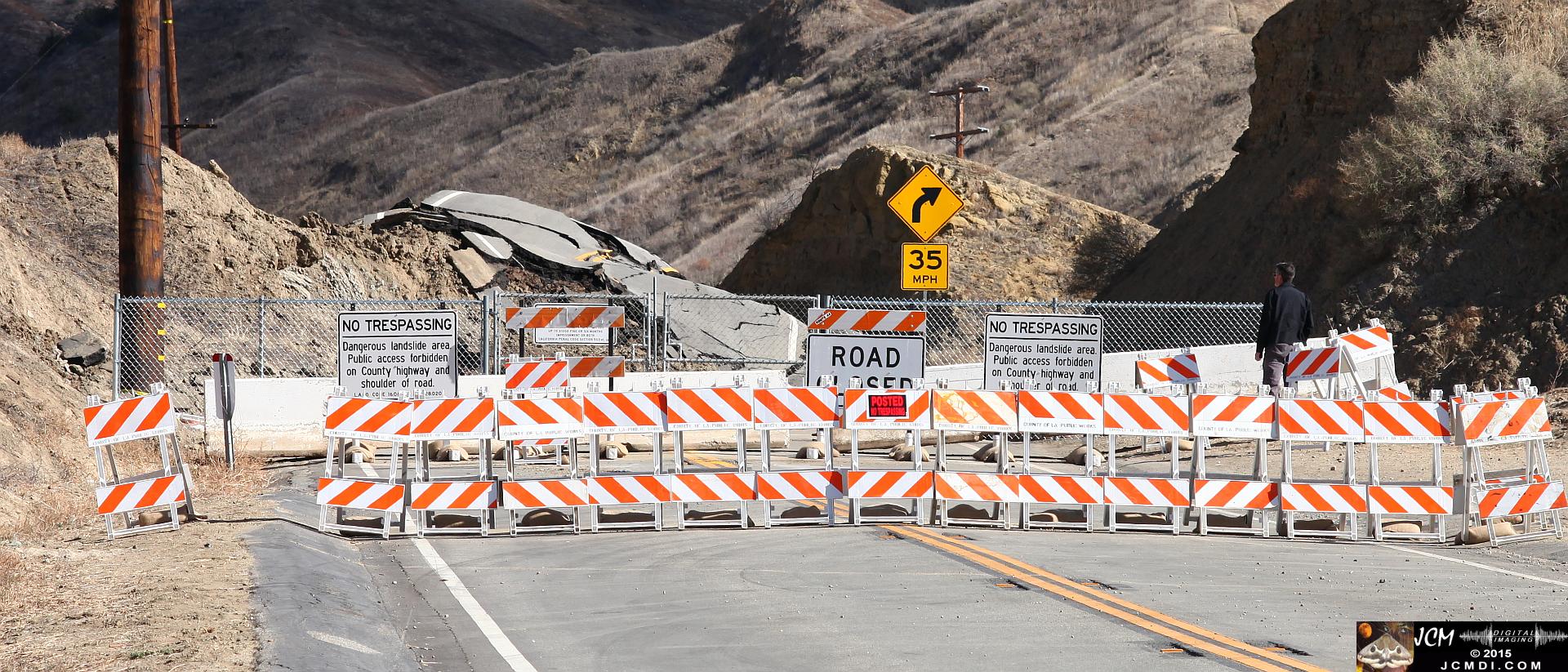 Landslide, buckled pavement, and terrain at Vasquez Canyon Road in Santa Clarita, CA filmed 11-25-2015